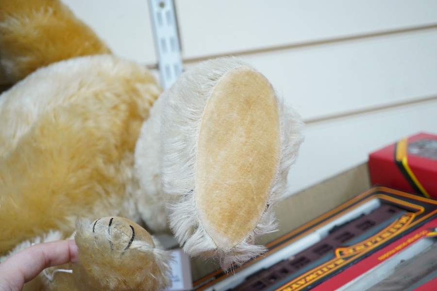 A gold plush mohair teddy bear, perhaps Chad Valley, circa 1950, approx 62cm tall. Condition - fair to good.